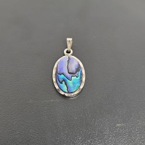 New Zealand Sea Opal pendant of Paua Shell on hammered silver backing